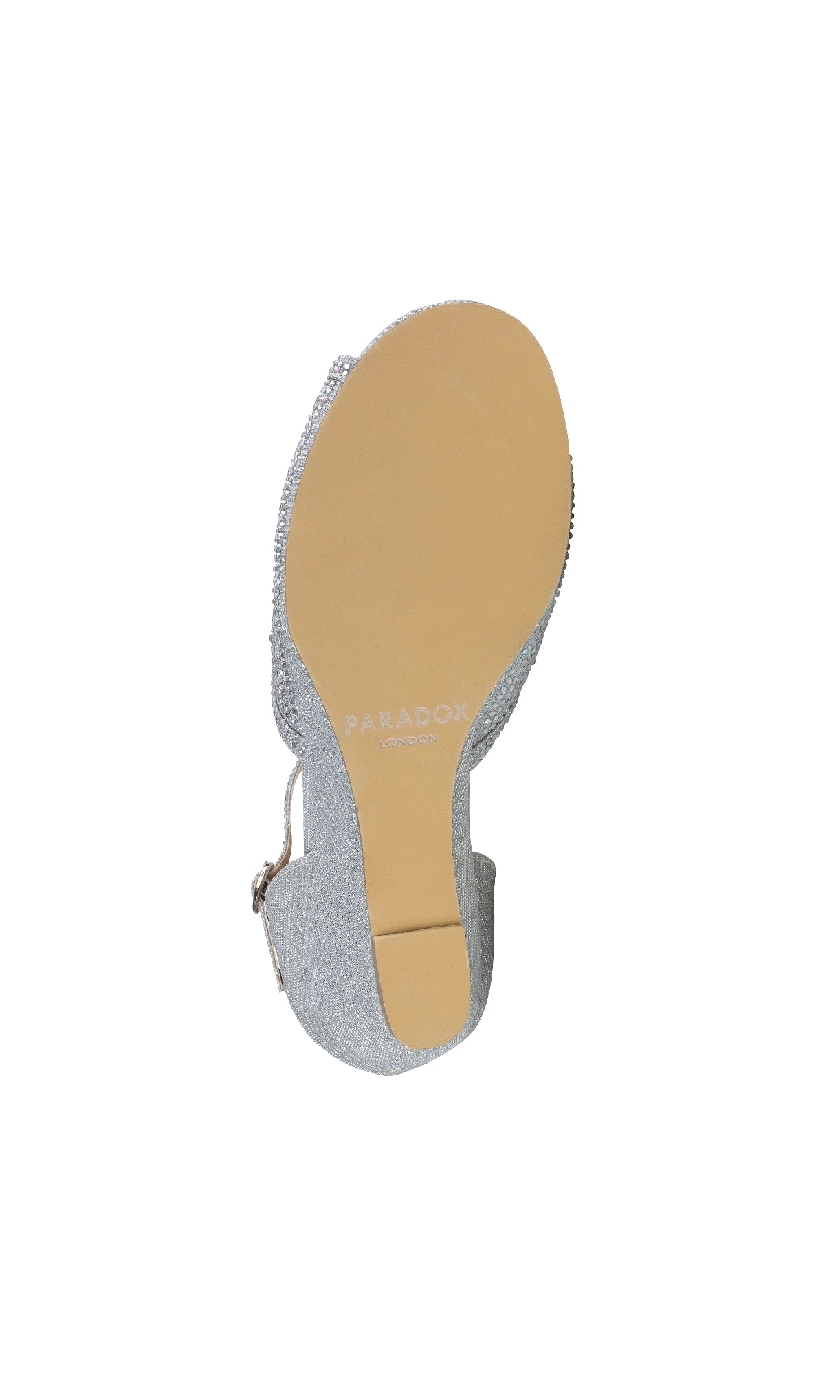 The image shows the sole of Janelle Silver Prom Shoes: Paradox London P2210, featuring a low wedge heel with a light tan bottom and branded